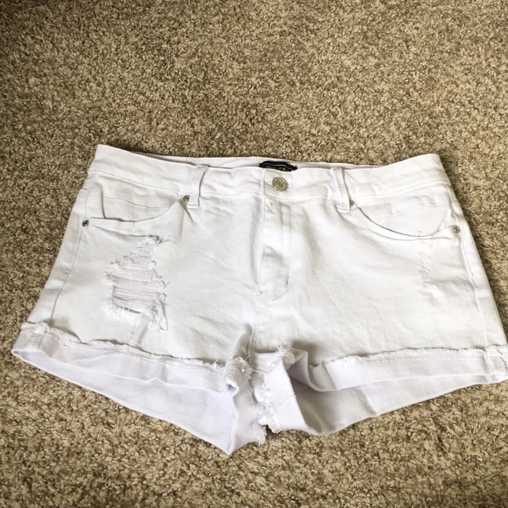White ripped jean shorts